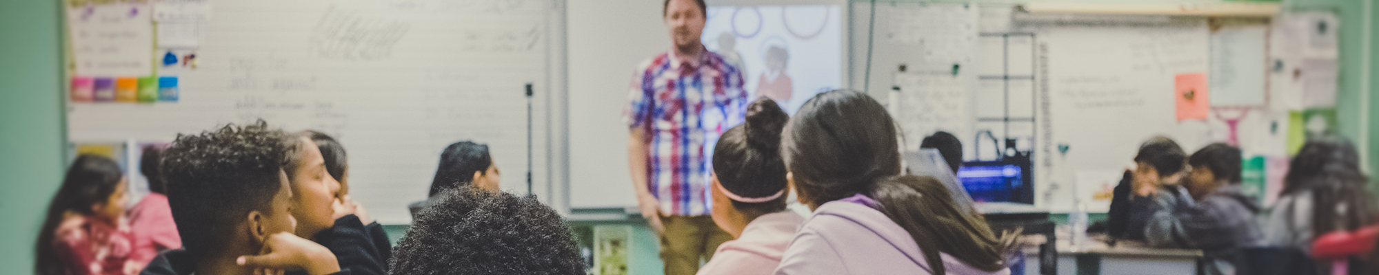teacher in front of a classroom of middle school students
